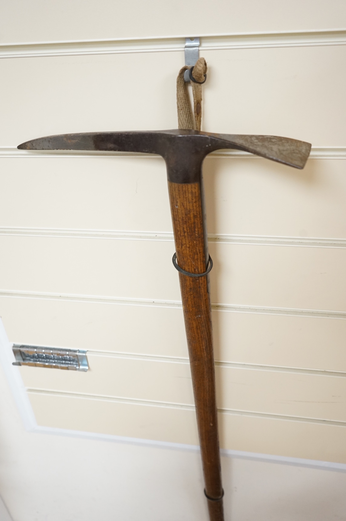 An early 20th century German mountaineer’s ice pick with oak shaft, the head stamped ‘Prima=Garantie Fulpmes’.